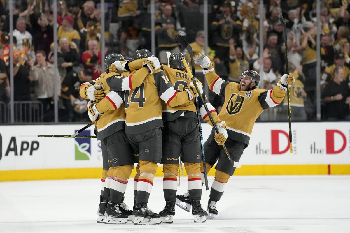 Vegas Golden Knights players celebrate a goal against the Florida Panthers in the third period.