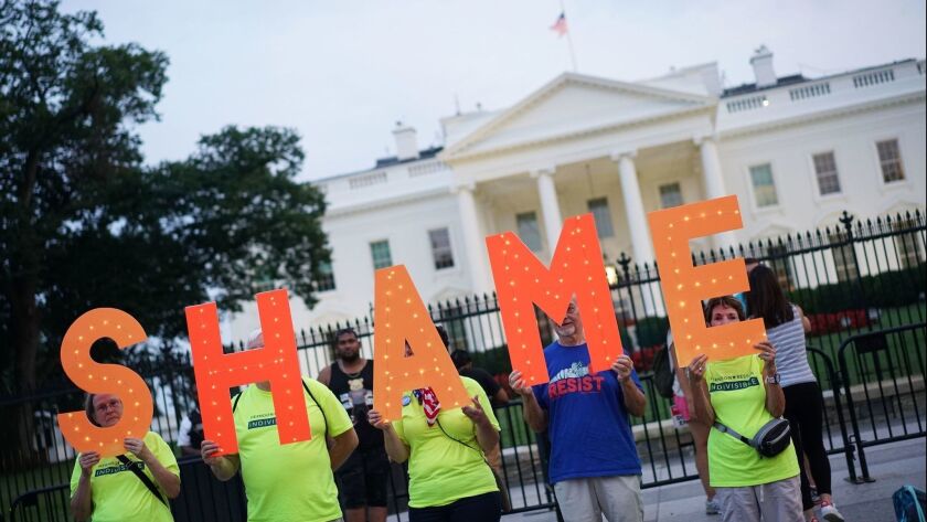 Demonstrators protest President Trump outside the White House on Aug. 27.