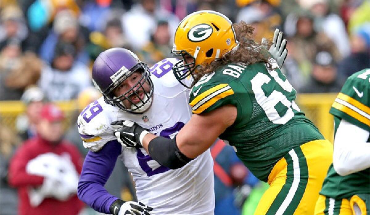 Green Bay tackle David Bakhtiari, right, is one of two players who violated the NFL's concussion protocol and re-entered games during wild-card weekend after suffering a potential concussion.