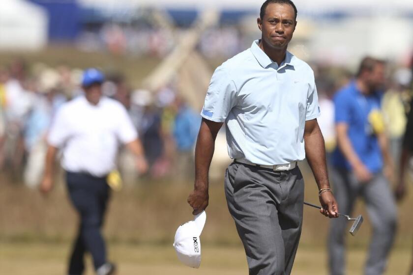 Tiger Woods walks onto the 18th green during the second round of the British Open.
