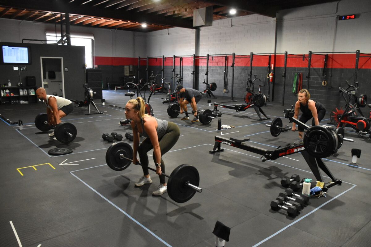 Members of Performance360 in Pacific Beach stay in designated workout zones to practice social distancing.