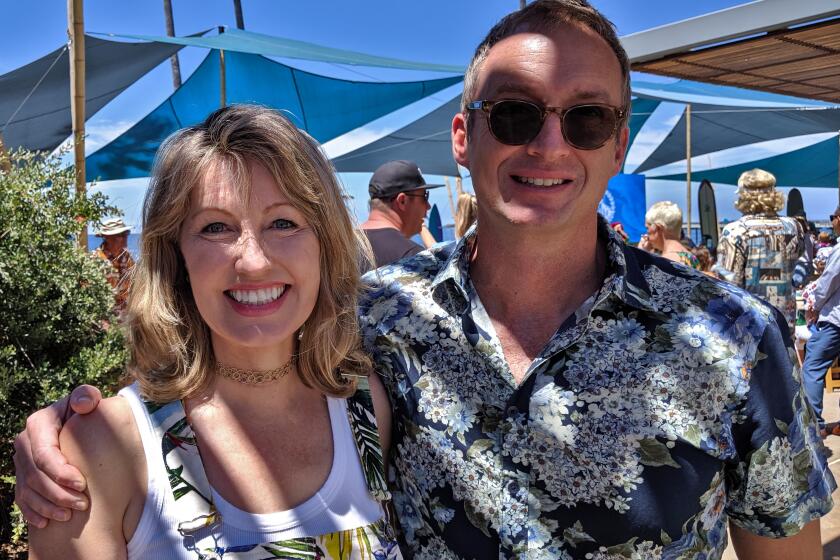 Dr. Catriona Jamieson and biotech executive John Hood, seen on Sunday, Aug. 18, at the 26th Annual Luau and Legends of Surfing Invitational. The fundraiser benefits UCSD Moores Cancer Center