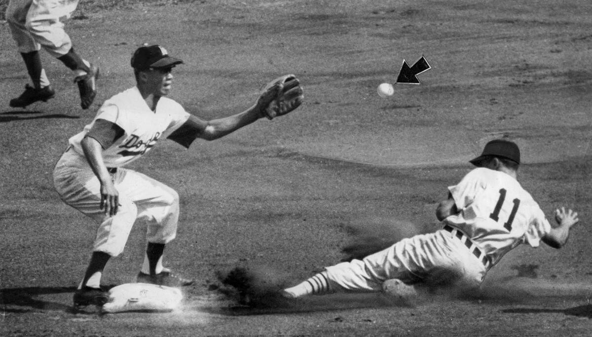 Oct. 5, 1959: White Sox Luis Aparicio steals second ahead of throw to Maury Wills, left, from Wally Moon. Game 4 of the 1959 World Series.