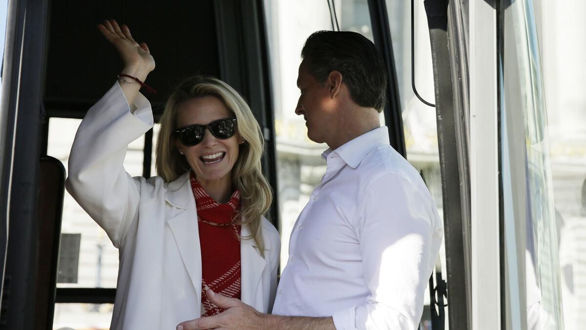 Gavin Newsom and his wife, Jennifer Siebel Newsom, in San Francisco during a bus tour kickoff of his campaign for governor.
