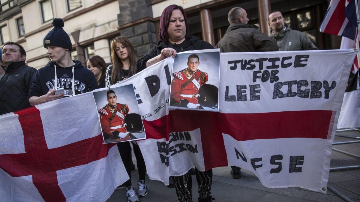 Protesters demonstrate outside the Old Bailey courthouse in London before the sentencing of Michael Adebolajo and Michael Adebowale, who were convicted of murdering British solider Lee Rigby. (Oli Scarff / Getty Images)