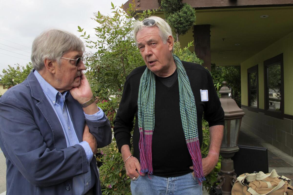 War photographer Tim Page, on right, with former AP bureau chief Richard Pyle in Garden Grove in 2011.