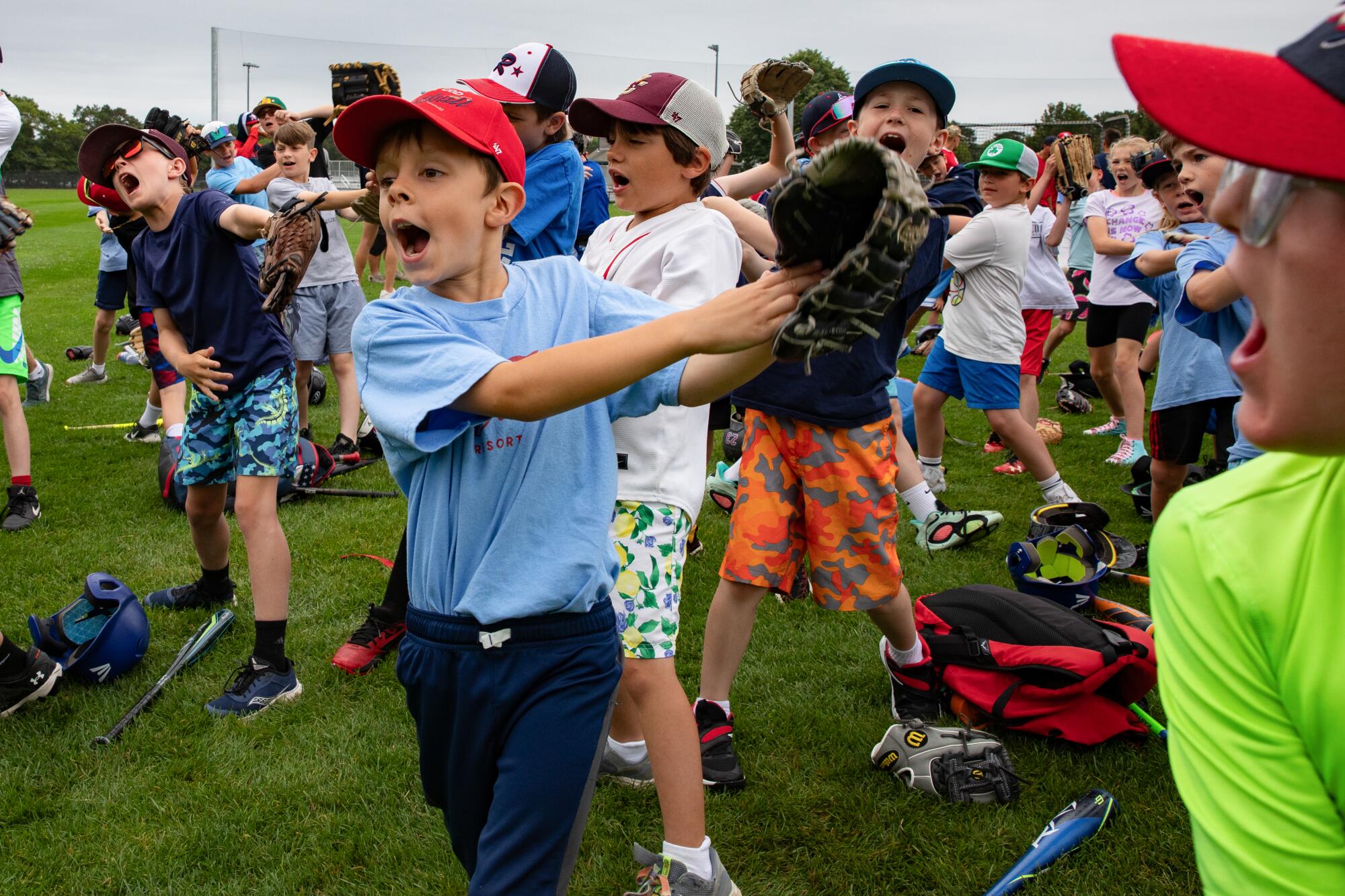 Children participate at a baseball youth clinic.