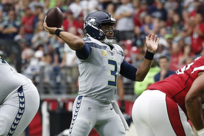 Seattle Seahawks quarterback Russell Wilson (3) throws against the Arizona Cardinals during the first half of an NFL football game, Sunday, Sept. 29, 2019, in Glendale, Ariz. (AP Photo/Ross D. Franklin)
