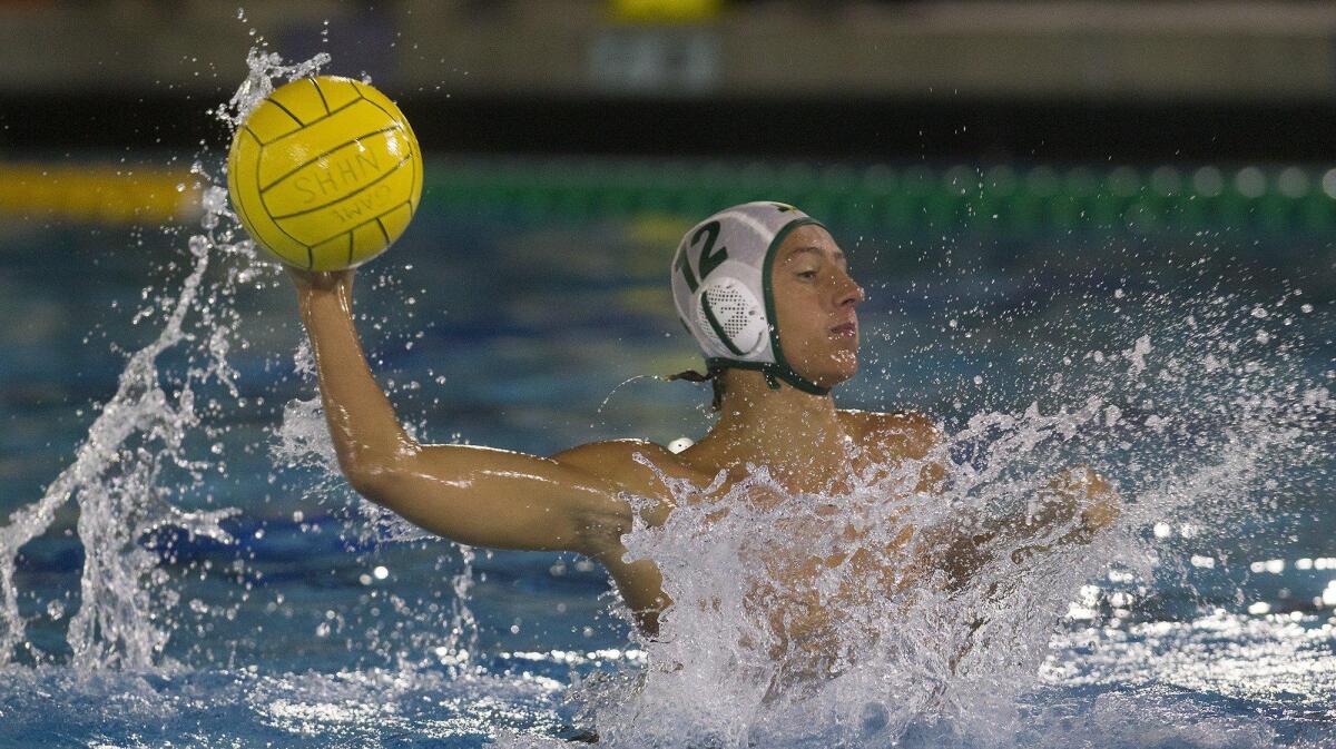 Edison High’s Austin Cozza (12) scores against Fountain Valley during the first half in a Sunset League match in Newport Beach on Wednesday.