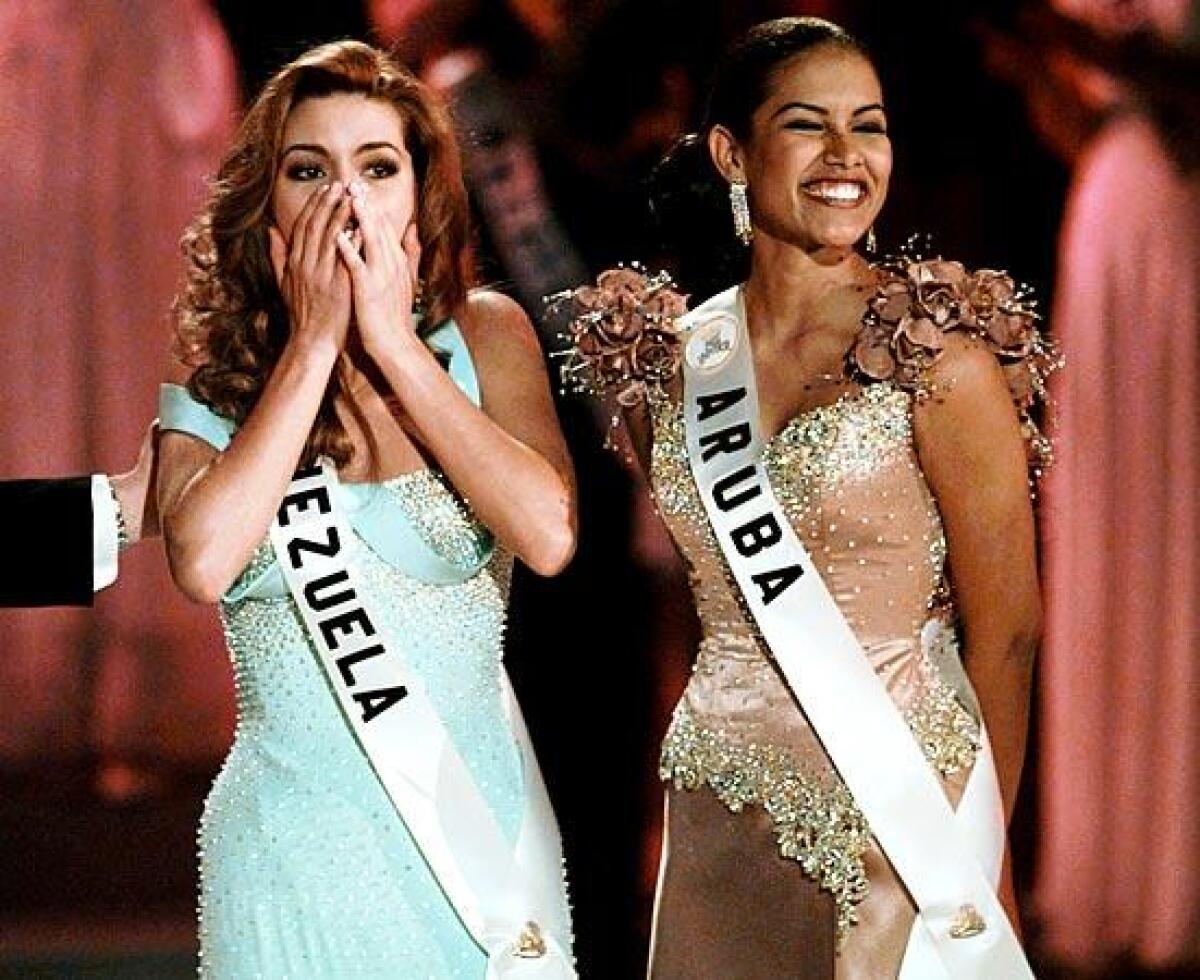 Miss Aruba Taryn Mansell looks on as Miss Venezuela Alicia Machado is named 1996 Miss Universe.