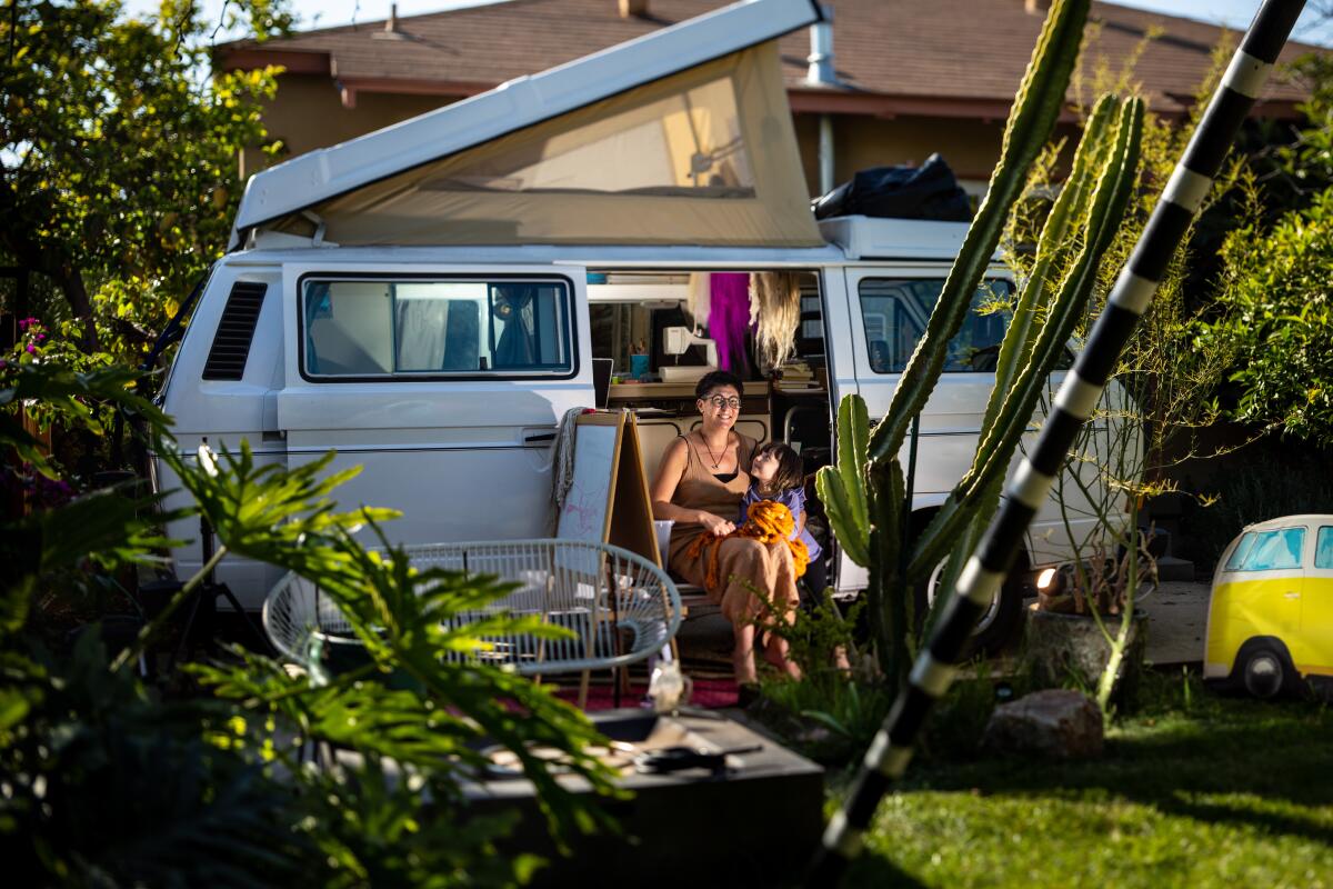 Tanya Aguiniga, a fiber artist from Tijuana, relaxes in her Volkswagen Westfalia