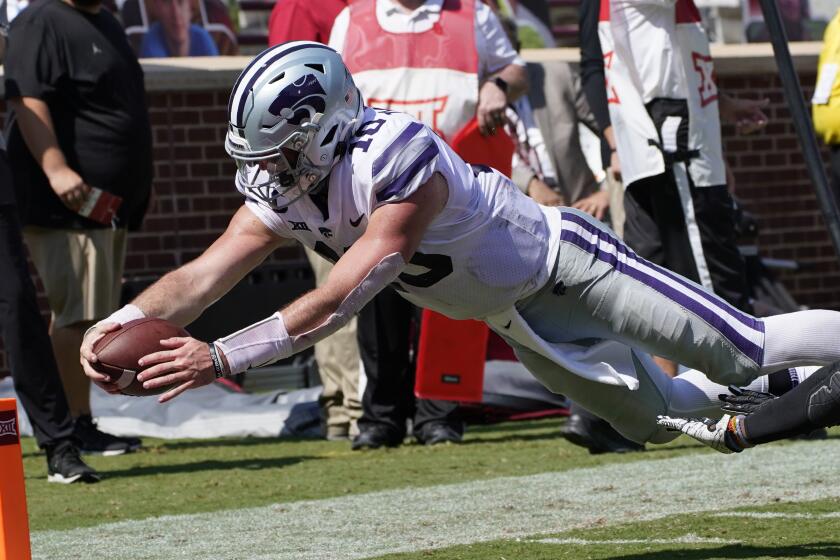 Kansas State quarterback Skylar Thompson (10) dives into the end zone for a touchdown.