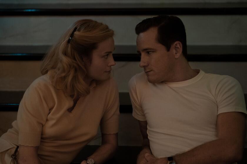 Episode 2. Brie Larson and Lewis Pullman in "Lessons in Chemistry," premiering October 13, 2023 on Apple TV+.