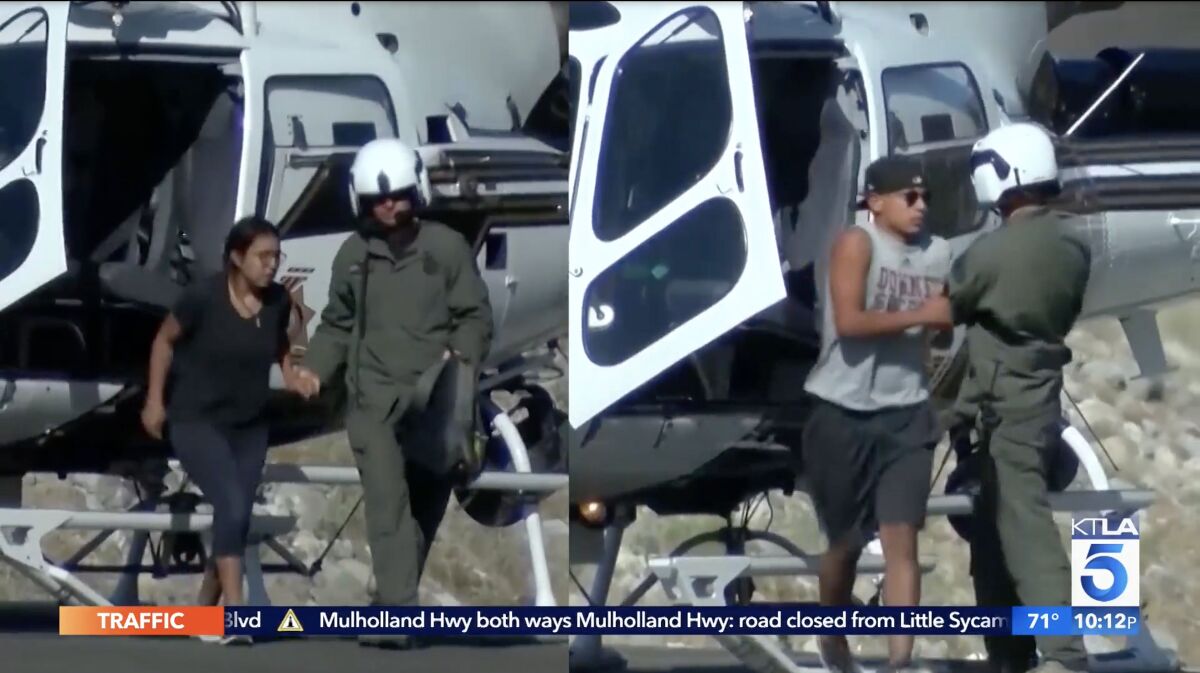 A frame grab from a split TV screen shows a man in a helmet assisting two young people out of a helicopter.