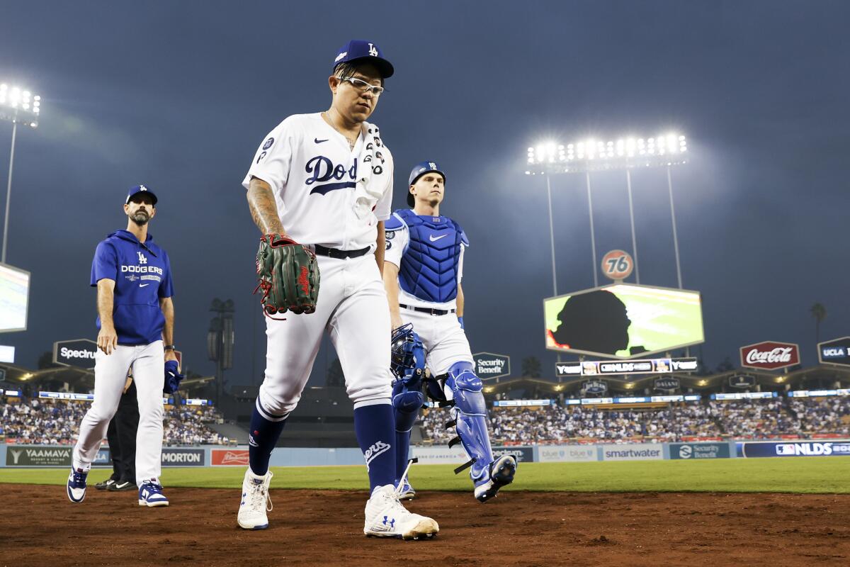 Dodgers pitcher Julio Urias walks to the dugout before Game 1 of the NLDS against the San Diego Padres at Dodger Stadium.