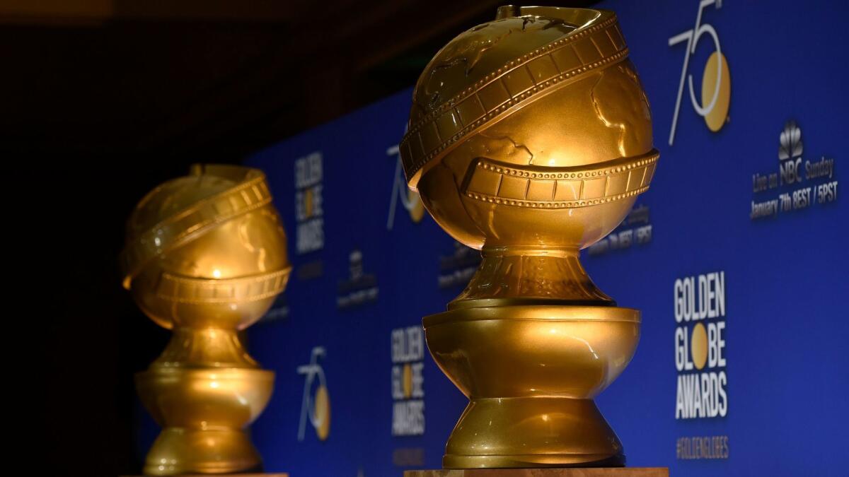 Golden Globe statues appear on stage prior to the nominations for the 75th Annual Golden Globe Awards in Beverly Hills, Calif. on Dec. 11, 2017.