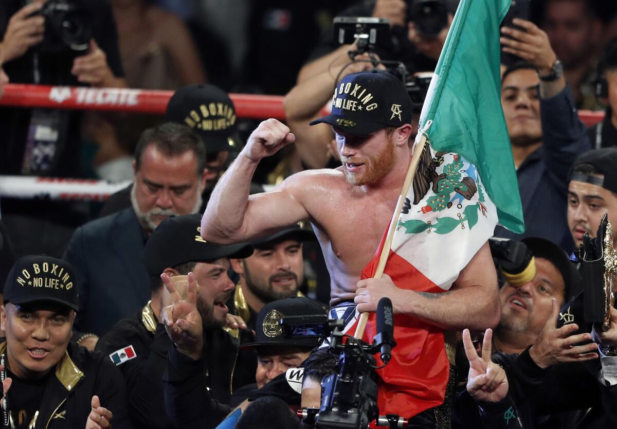 Canelo Alvarez, of Mexico, celebrates after defeating WBC/WBA middleweight champion Gennady Golovkin, of Khazakstan, in a title boxing fight at T-Mobile Arena in Las Vegas, Saturday, Sept. 15, 2018. Alvarez took Glolovkin's WBC/WBA titles by majority decision.