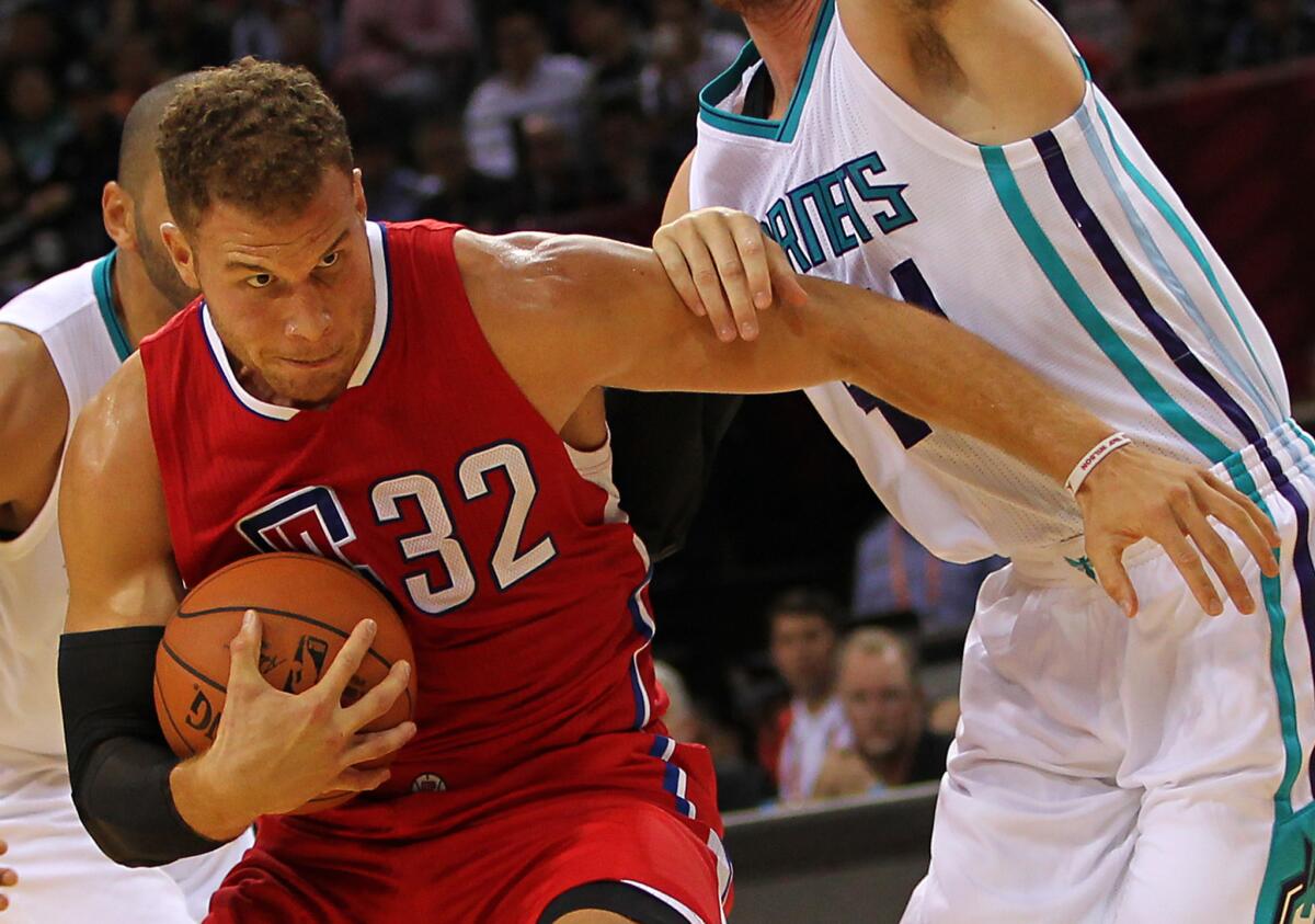 Clippers forward Blake Griffin works against the Charlotte Hornets as part of the 2015 NBA Global Games China on Oct. 11 in Shenzhen, China.