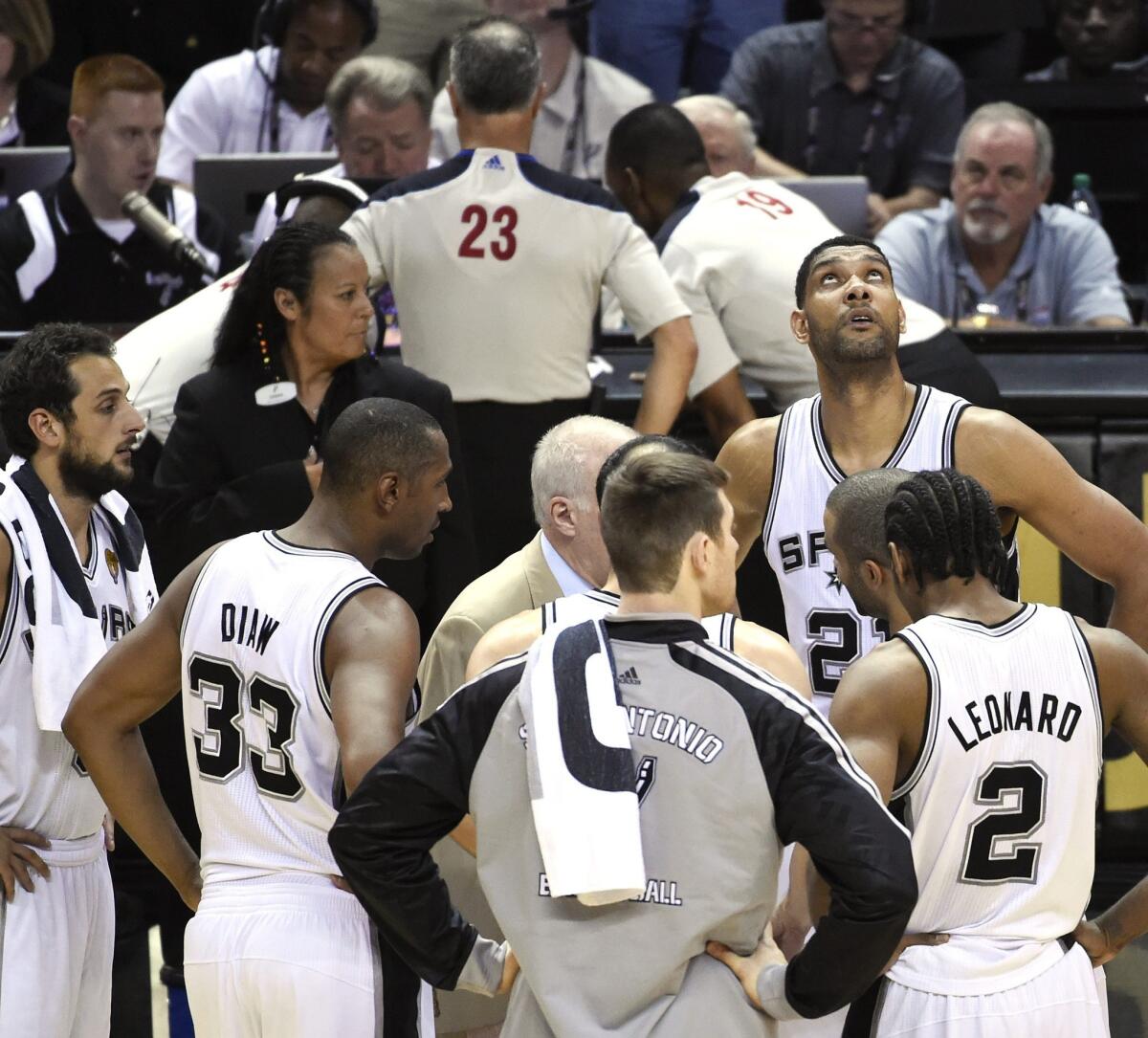 Officials review a play during the second half of Game 2 of the NBA Finals between the Miami Heat and San Antonio Spurs.