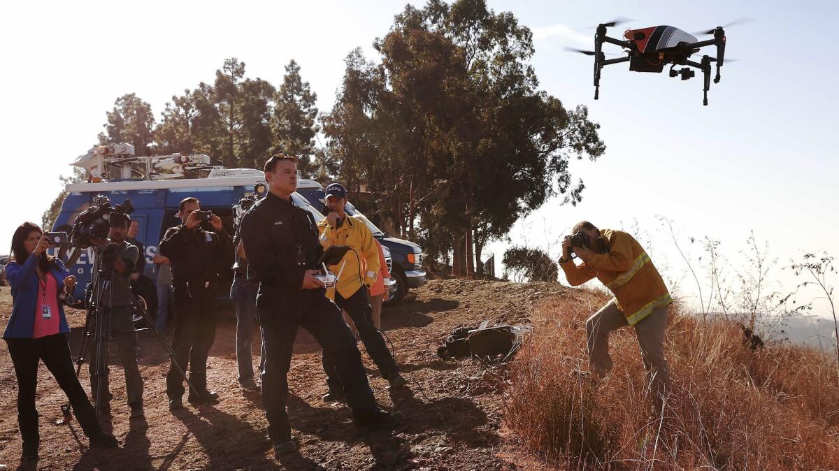 LAFD firefighter Derrick Ward flies a drone used in the Skirball Fire, to provide post-fire damage assessment and infrared capability to identify remaining hot spots.