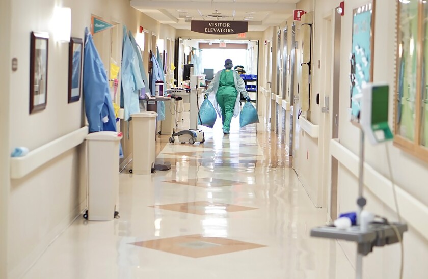 A worker walks down a hallway inside Phoebe Putney Memorial Hospital in Albany, Ga. 