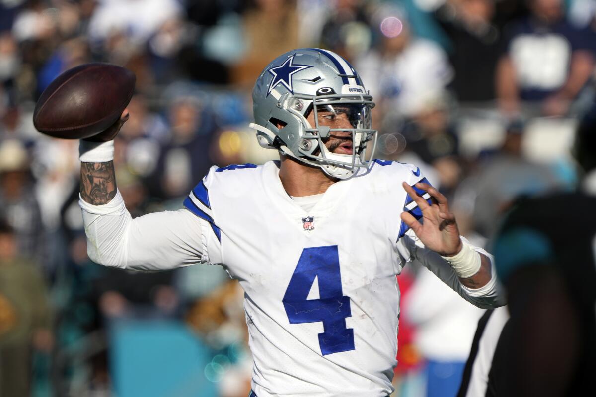Dallas Cowboys quarterback Dak Prescott looks for a receiver against the Jacksonville Jaguars.