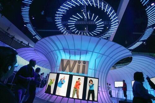 People walk past a Nintendo Wii display at the 2006 Electronic Entertainment Expo.