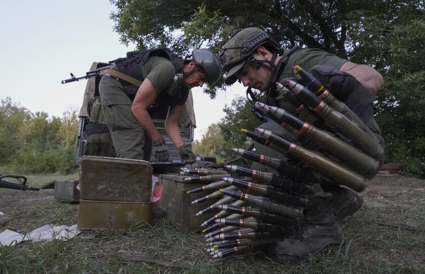 Ukrainian servicemen preparing materiel