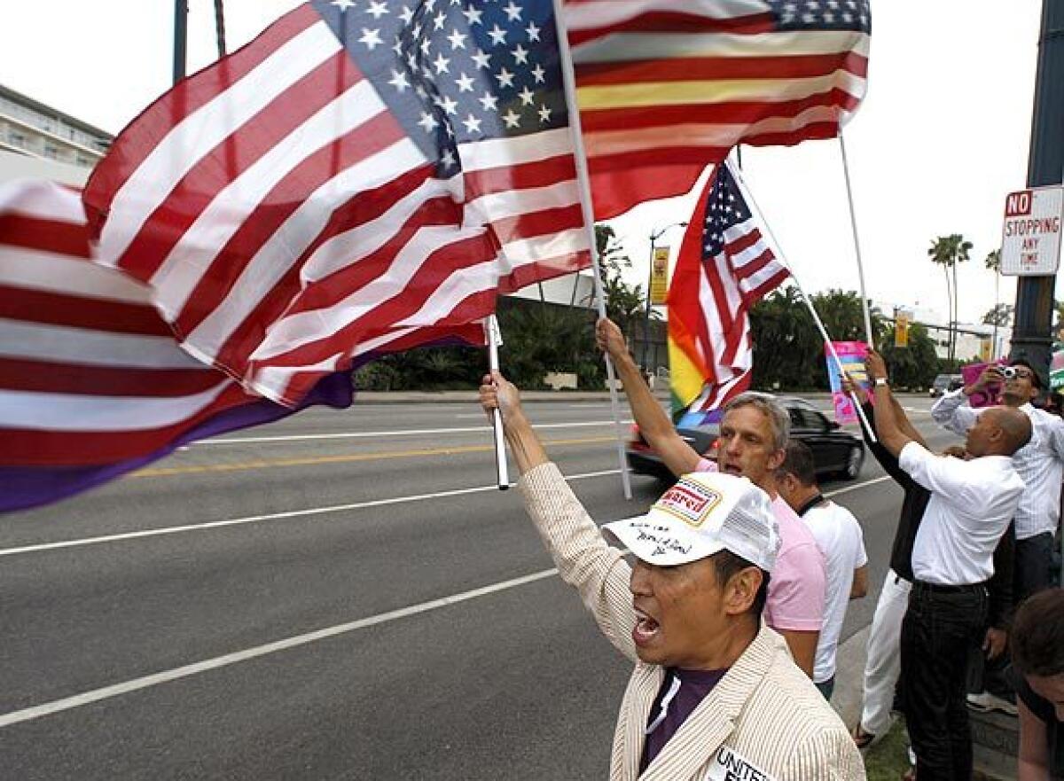 Protesters who oppose the state Supreme Court decision to uphold Proposition 8 gather across from the Beverly Wilshire Hotel, where President Obama was attending a fundraiser.