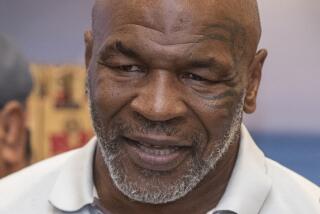 Santa Ana, CA - July 21: Former heavyweight champion and cannabis entrepreneur Mike Tyson signs autographs and takes photos with fans while promoting his Tyson Ranch brand at Planet 13 dispensary in Santa Ana on Wednesday, July 21, 2021. (Allen J. Schaben / Los Angeles Times)