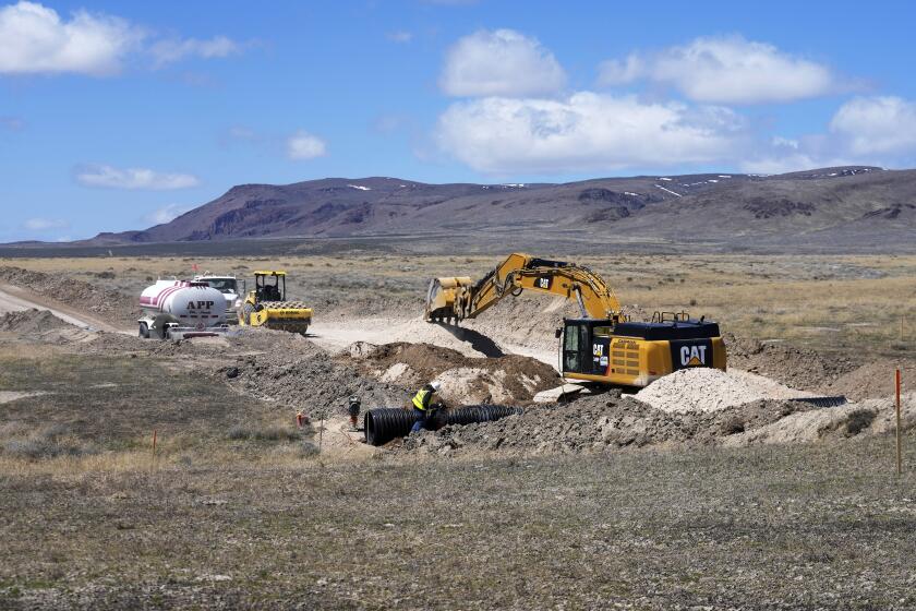 FILE - Construction continues at the Thacker Pass lithium mine on April 24, 2023, near Orovada, Nev. The Biden administration has agreed to provide a $2.26 billion conditional loan to Lithium Americas, Thursday, March 14, 2024, to help cover construction costs of a processing facility at its giant lithium mine in the works in northern Nevada near the Oregon line. (AP Photo/ Rick Bowmer, File)