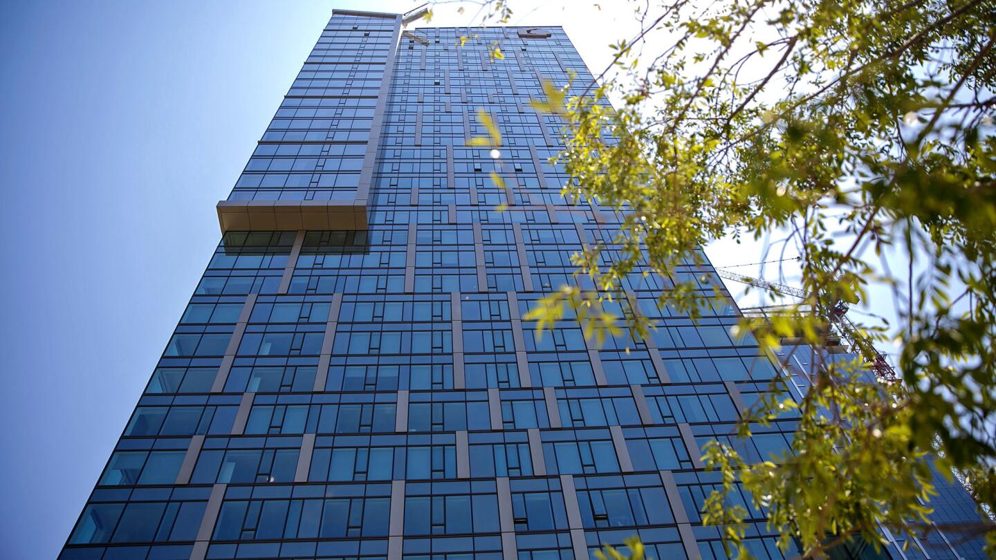 Tower 1 of Metropolis, one of the biggest real estate developments in Los Angeles history, officially opens Thursday amid a wave of construction downtown.