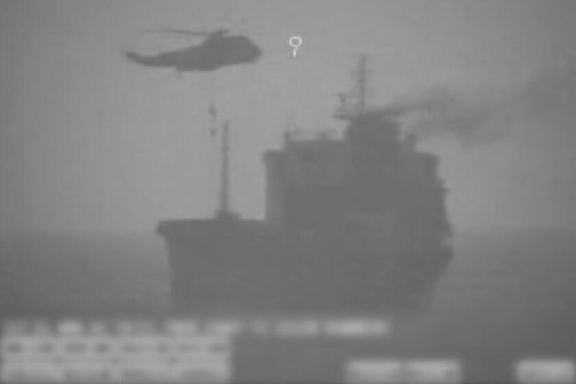 Iranian commandos fast-rope down from a helicopter onto the MV Wila oil tanker in the Gulf of Oman on Wednesday.