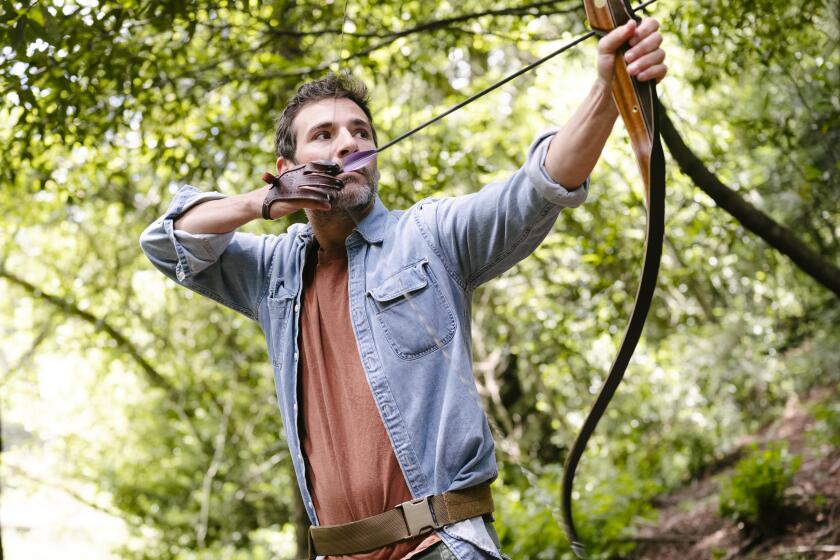 eff Bercovici shoots his bow at Redwood Bowman archery range