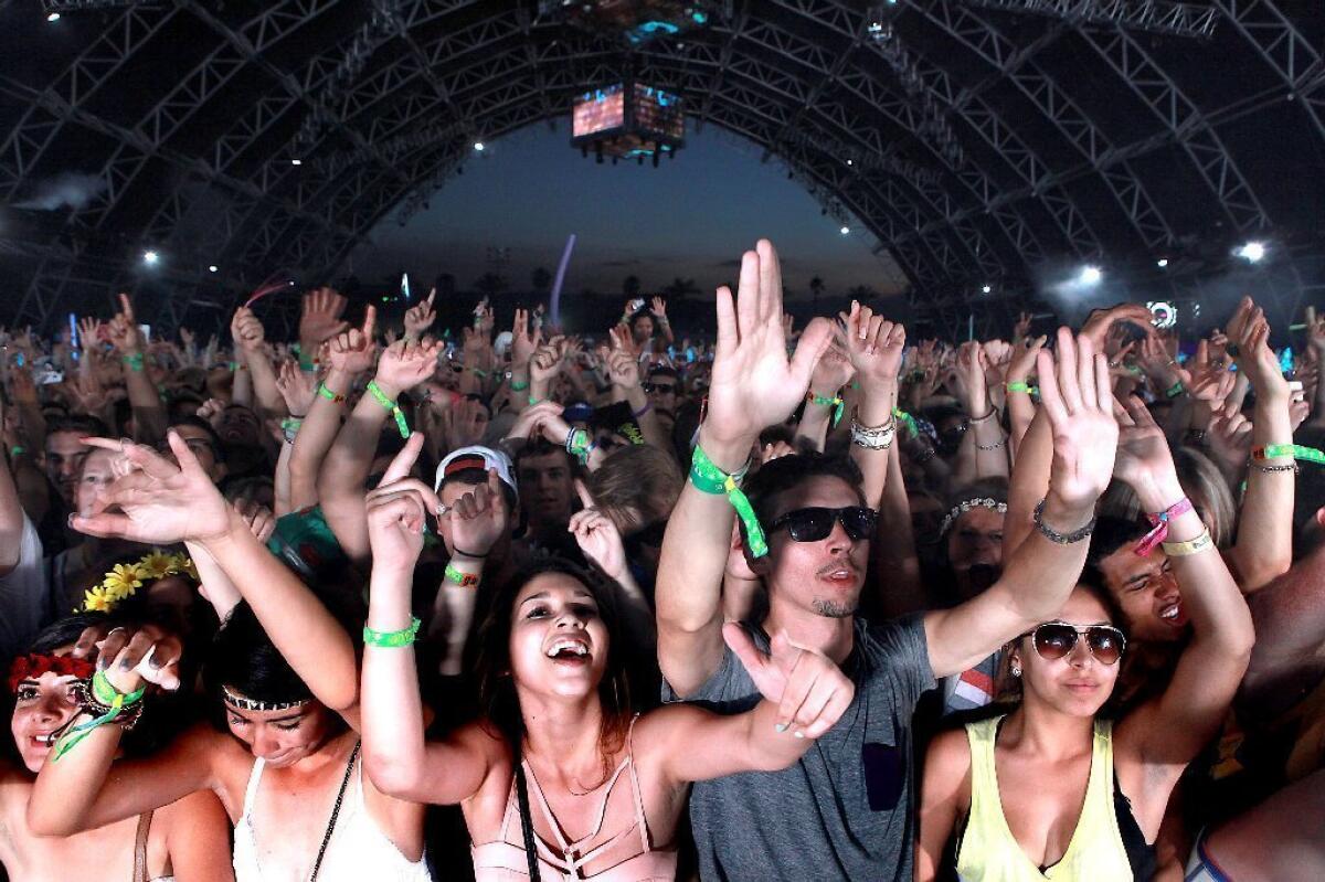 Fans in the Sahara tent dance to Dog Blood at the Coachella Music & Arts Festival Friday night.