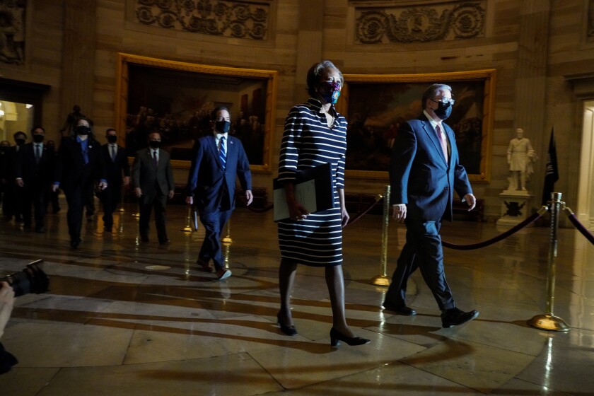  Democratic House impeachment managers walk in the Capitol to deliver article of impeachment.