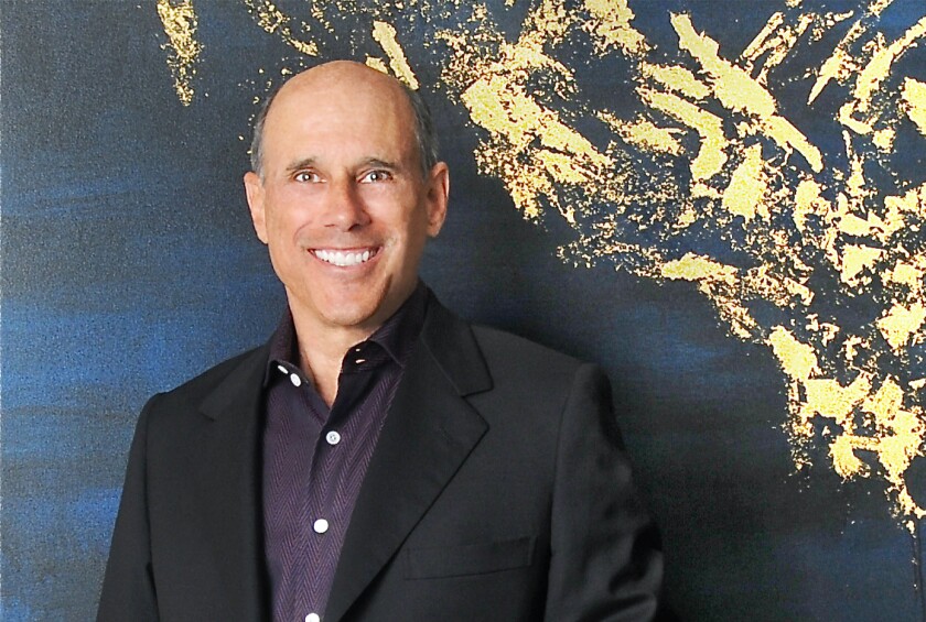 Jeff Hyland smiles in a portrait
