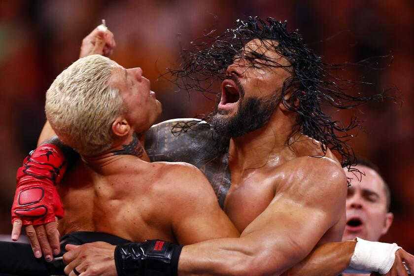 INGLEWOOD, CALIFORNIA - APRIL 02: (L-R) Cody Rhodes wrestles Roman Reigns for Undisputed WWE Universal Title.
