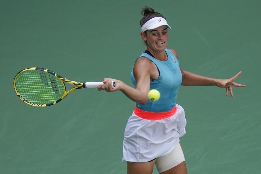 Jennifer Brady, of the United States, returns a shot to Yulia Putintseva, of Kazakhstan, during the quarterfinals of the US Open tennis championships, Tuesday, Sept. 8, 2020, in New York. (AP Photo/Seth Wenig)