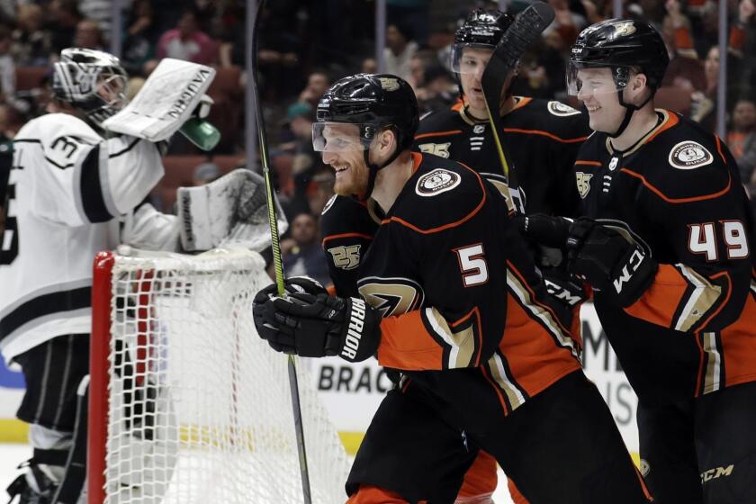 Anaheim Ducks' Korbinian Holzer (5) celebrates his goal with teammates during the second period of an NHL hockey game against the Los Angeles Kings on Friday, April 5, 2019, in Anaheim, Calif. (AP Photo/Marcio Jose Sanchez)