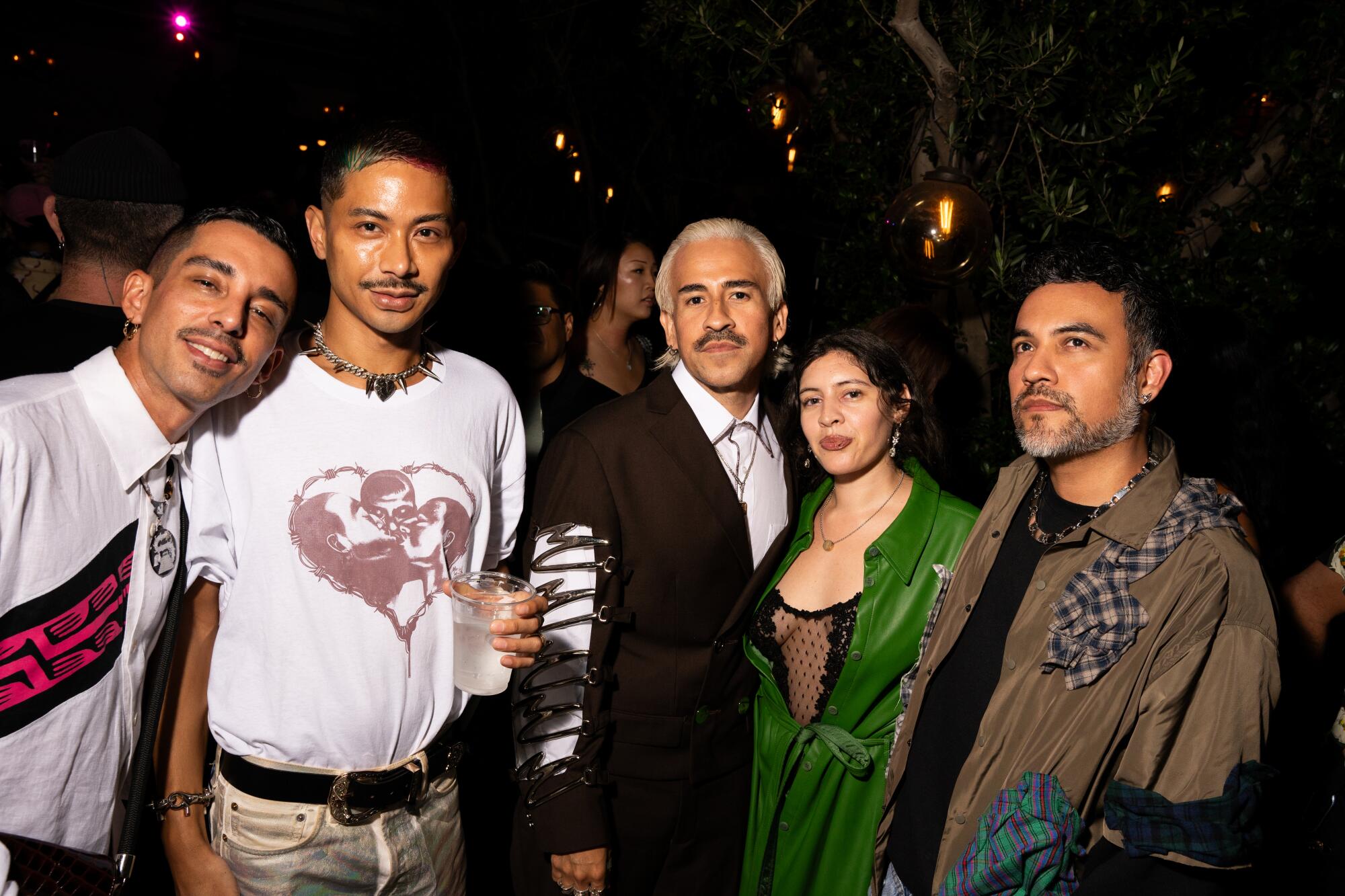 Photographer Eric Solis and designer Hoza Rodriguez with friends.