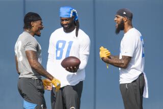 Chargers safety Derwin James (left) talks with receivers Mike Williams (81) and Keenan Allen.