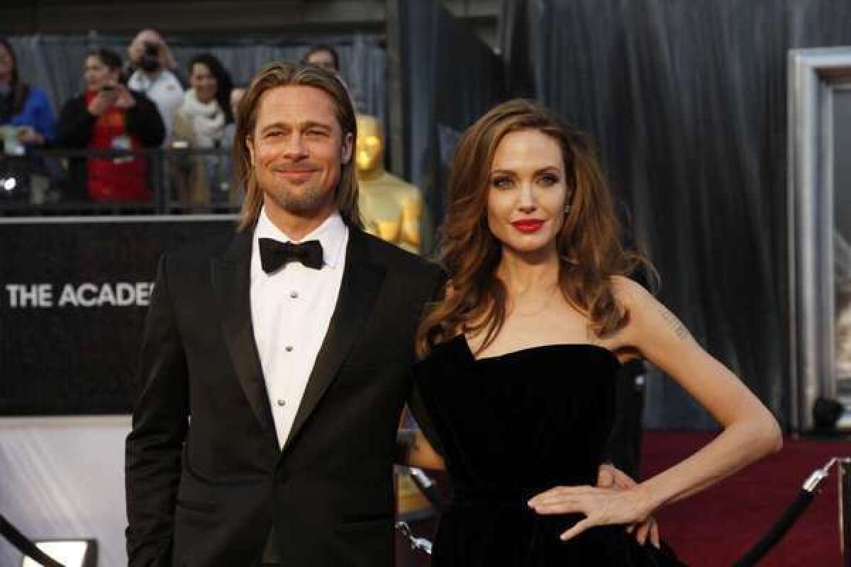 Brad Pitt and Angelina Jolie make their entrance during the 66th annual Golden Globe Awards in February 2012.