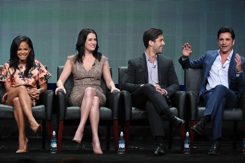 Actors Christina Milian, from left, Paget Brewster, Josh Peck and John Stamos participate in the "Grandfathered" panel at the Fox Summer TCA Tour at the Beverly Hilton Hotel on Thursday, Aug. 6, 2015, in Beverly Hills.