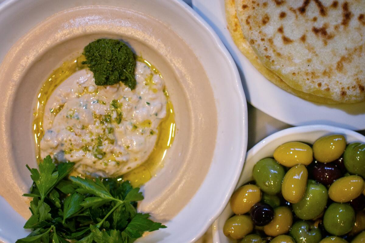 Hummus masabacha, olives and pita at Bavel