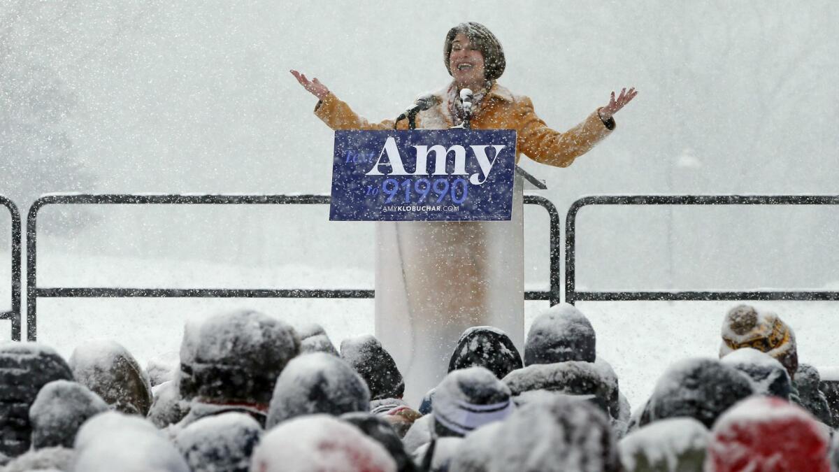 Sen. Amy Klobuchar (D-Minn.) addresses the crowd at a snowy rally where she announced she is entering the race for her party's presidential nomination Sunday.