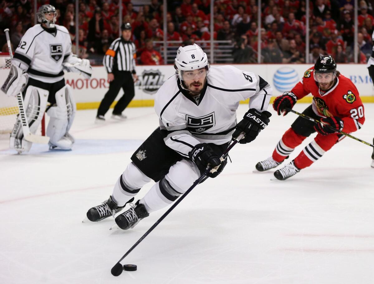 Defenseman Drew Doughty skates toward the Blackhawks' end of the ice with the puck during the second period of the Kings' 3-1 loss to Chicago in the opening game of the Western Conference finals.