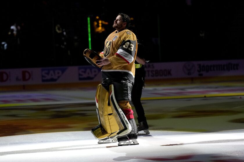Vegas Golden Knights goaltender Adin Hill (33) acknowledges the fans after Game 1 of the NHL hockey Stanley Cup Finals against the Florida Panthers, Saturday, June 3, 2023, in Las Vegas. The Golden Knights defeated the Panthers 5-2. (AP Photo/John Locher)