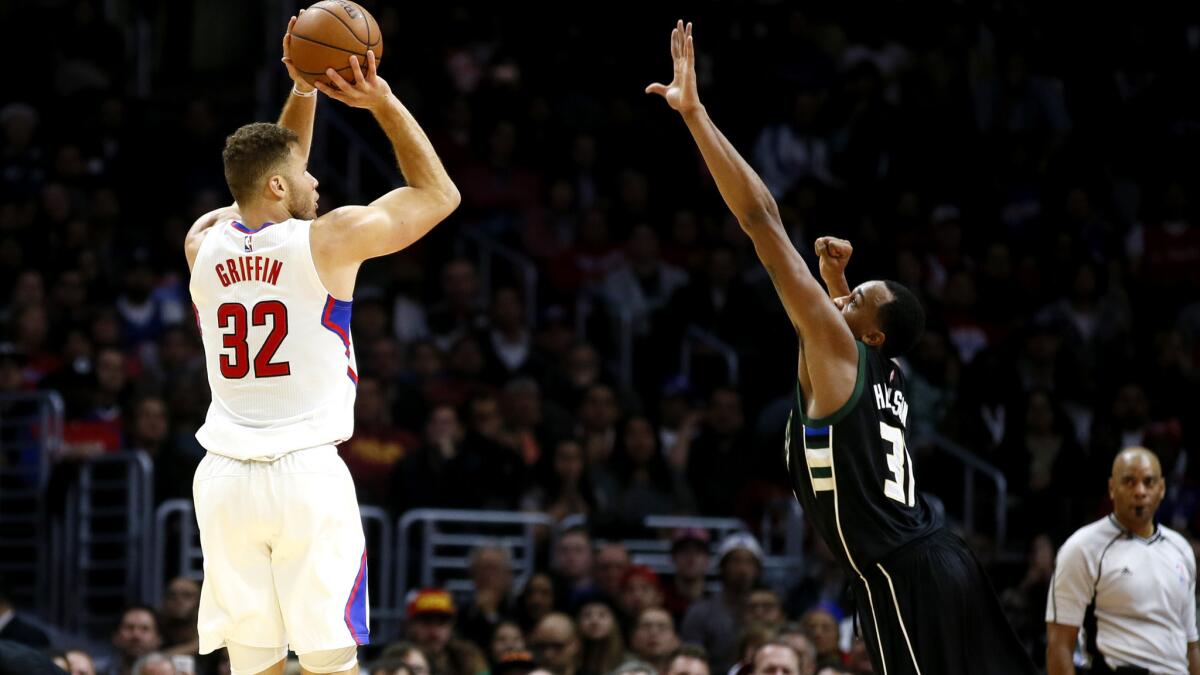 Clippers forward Blake Griffin elevates for a long-range shot over Bucks forward John Henson during a game Wednesday.