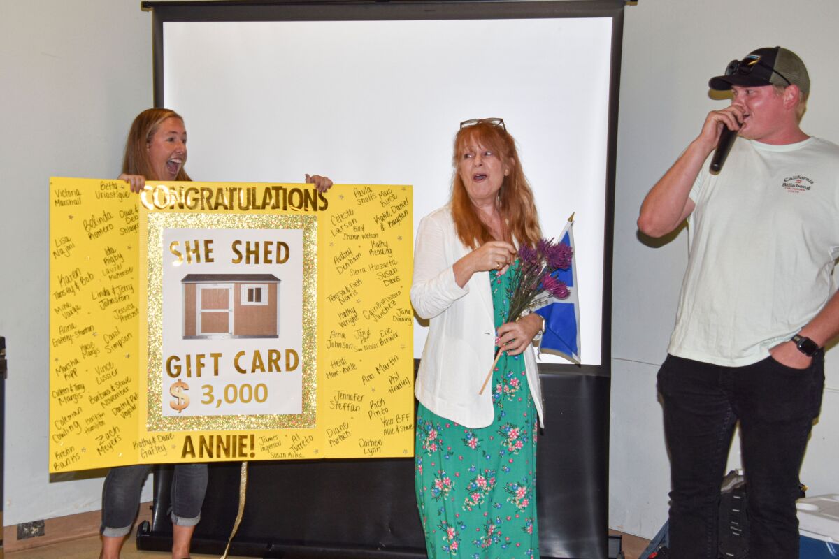 Annie Ransom’s colleagues and volunteers contributed to a $3,000 gift card to help her build her dream “She Shed.” 